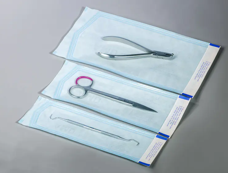 How do self-sealing sterilization bags ensure the sterile barrier of medical devices?